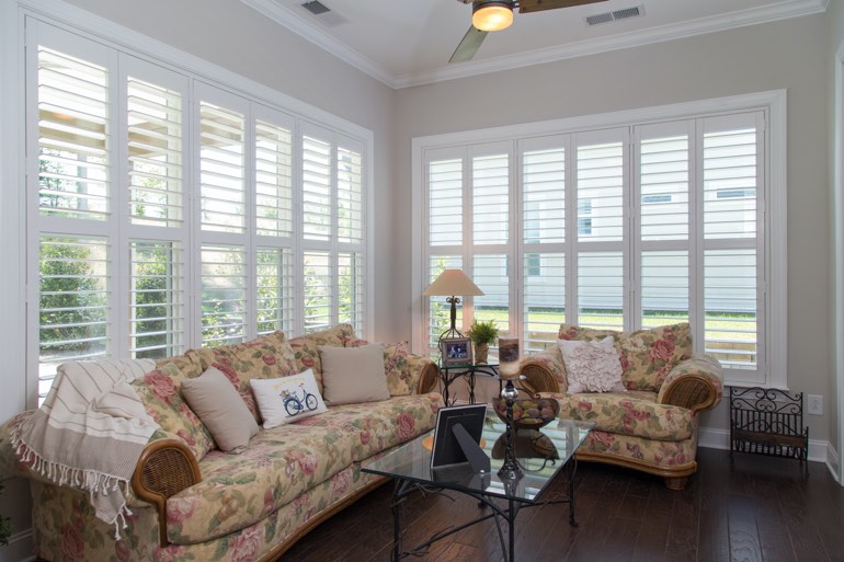 Traditional sunroom with faux wood shutters in Southern California.